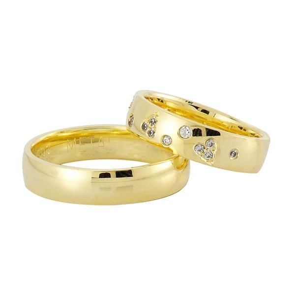 Nuran vielsesringe i guld med 14 brillanter og stjernedrys design