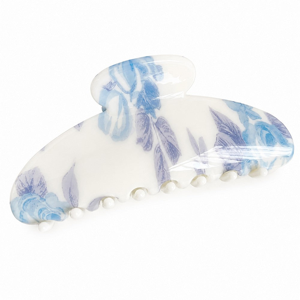 Elegante Haarspange aus cremeweißem Acryl mit raffiniertem, abstraktem Blumenprint in zartem Puderblau – Schmuckzentrum