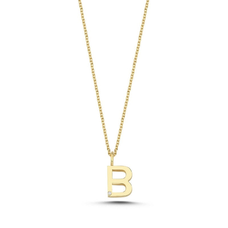 Buchstabenanhänger in 14 kt Gold mit 0,005 ct. 9,5 mm