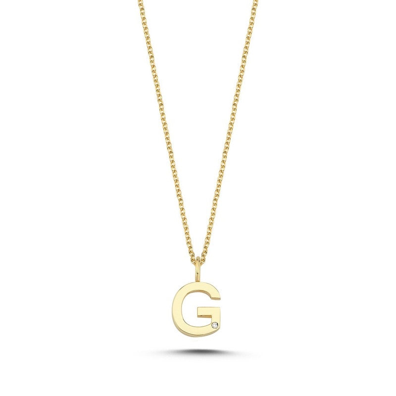 Buchstabenanhänger in 14 kt Gold mit 0,005 ct. 9,5 mm