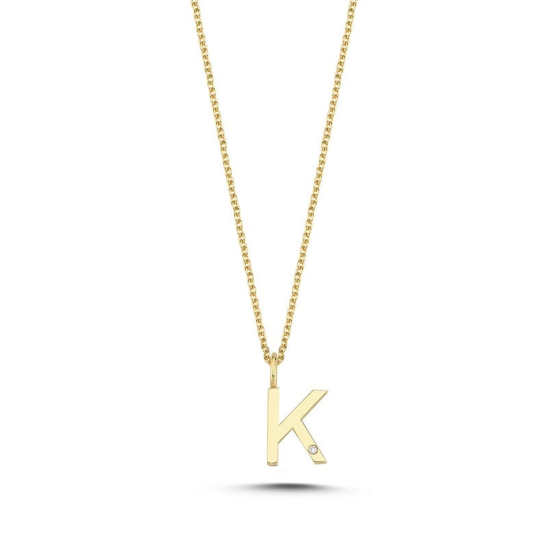 Buchstabenanhänger in 14 kt Gold mit 0,005 ct. 9,5 mm