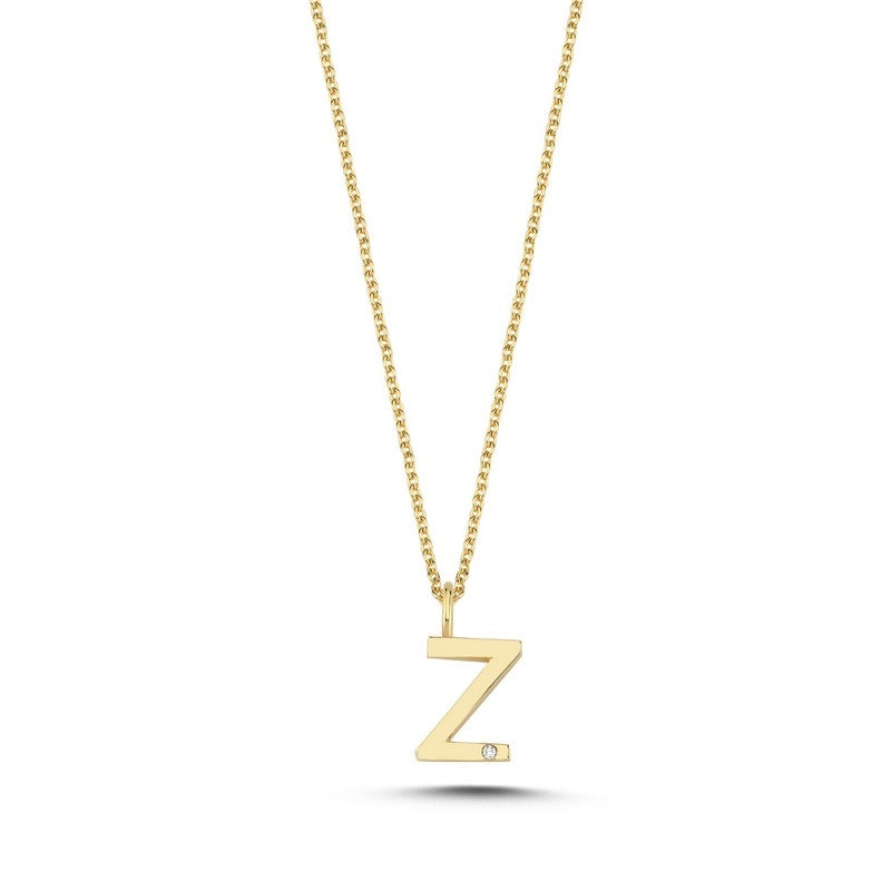 Buchstabenanhänger in 14 kt Gold mit 0,005 ct. 9,5 mm