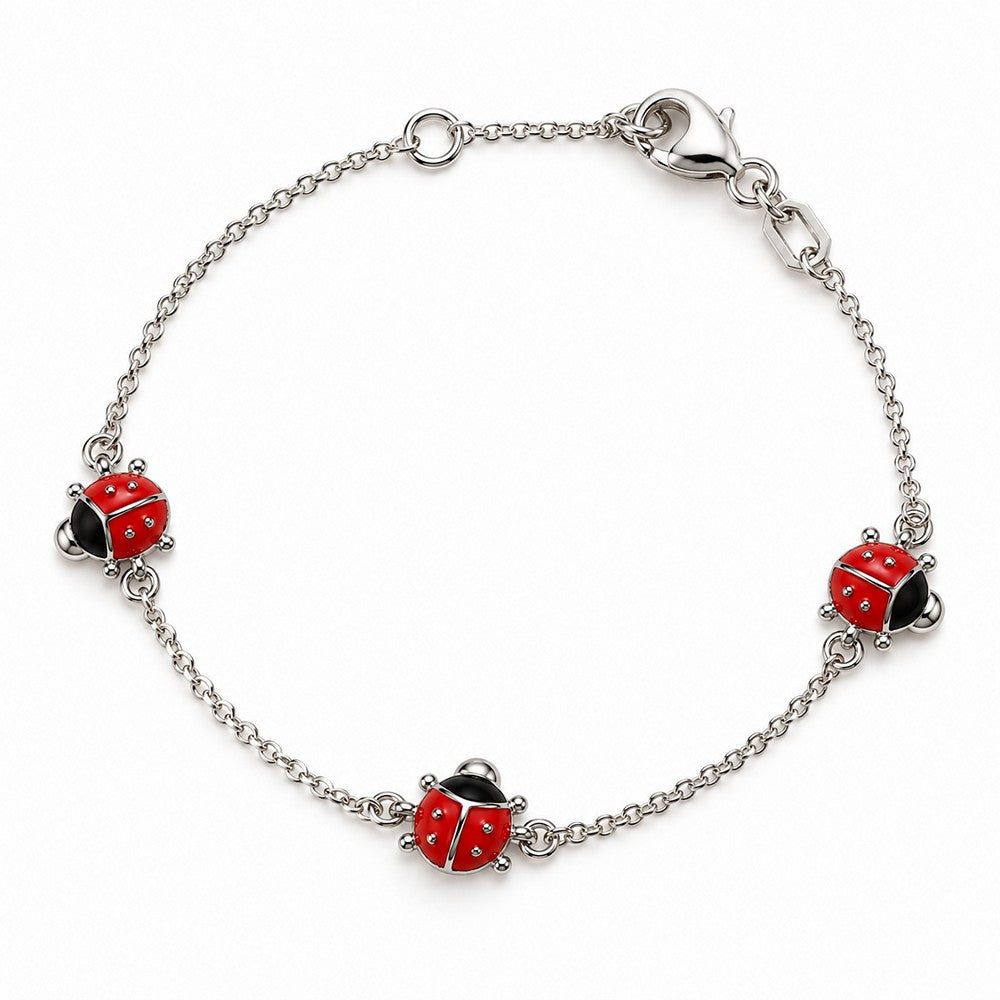Stilvolles Kinderarmband aus rhodiniertem Silber mit drei niedlichen Marienkäfern in leuchtend roter Emaille