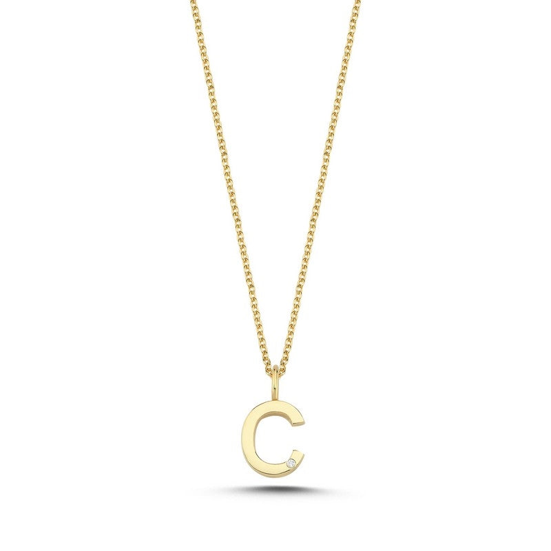 Buchstabenanhänger in 14 kt Gold mit 0,005 ct. 9,5 mm