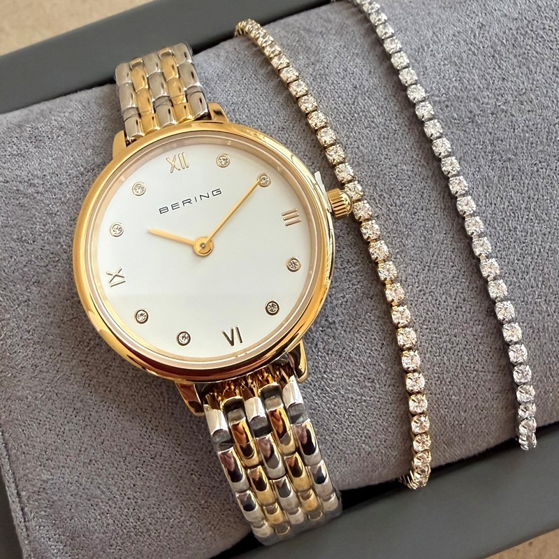 BERING Damenuhr aus Bi-Color-Stahl mit Tennisarmbändern